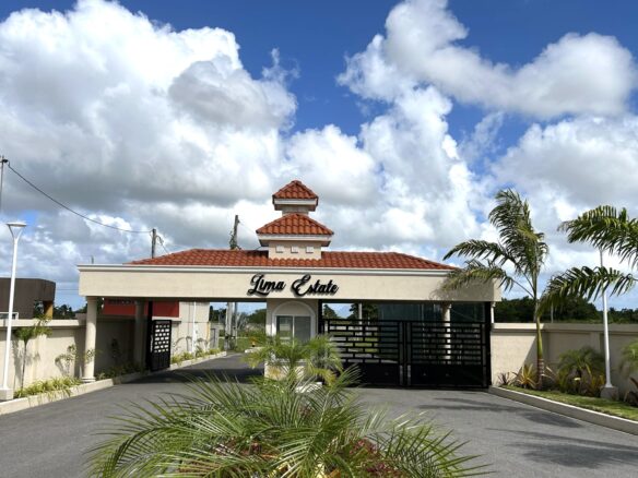 Gated entrance to Lima Estates, a modern Freeport community with new homes for sale.