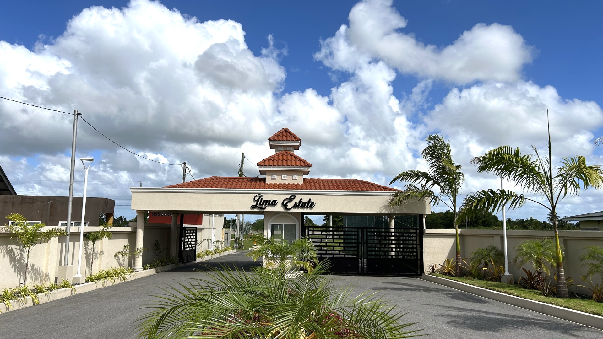 Gated entrance to Lima Estates, a modern Freeport community with new homes for sale.