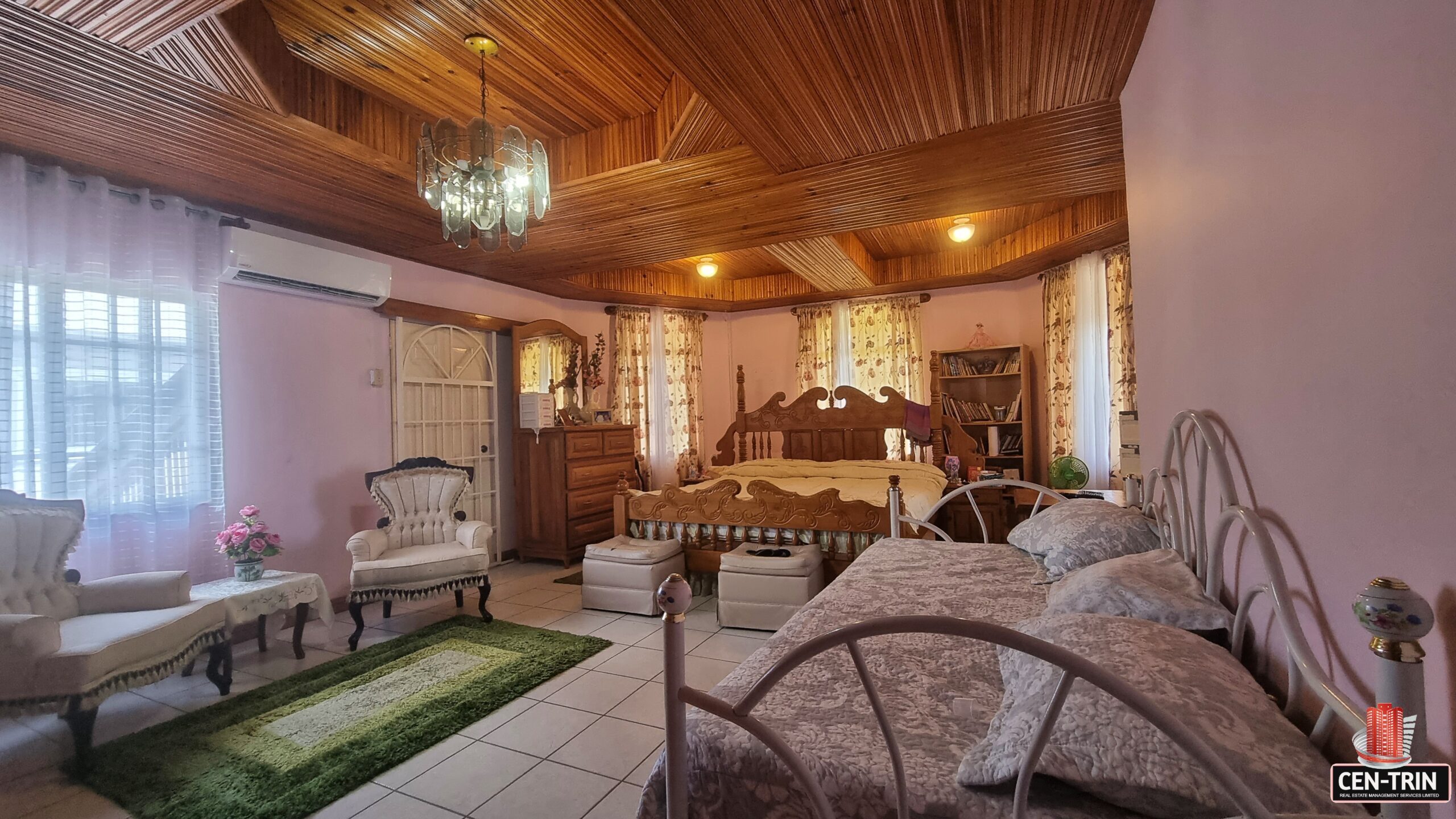 Photo showcasing the spacious master suite with an en-suite bathroom and walk-in closet.