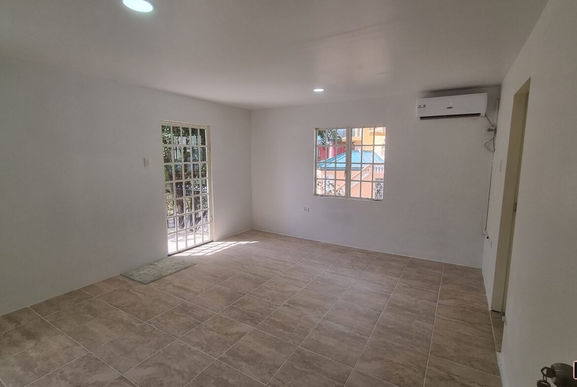 Master bedroom with outdoor balcony & window in a 3 bedroom townhouse rental.