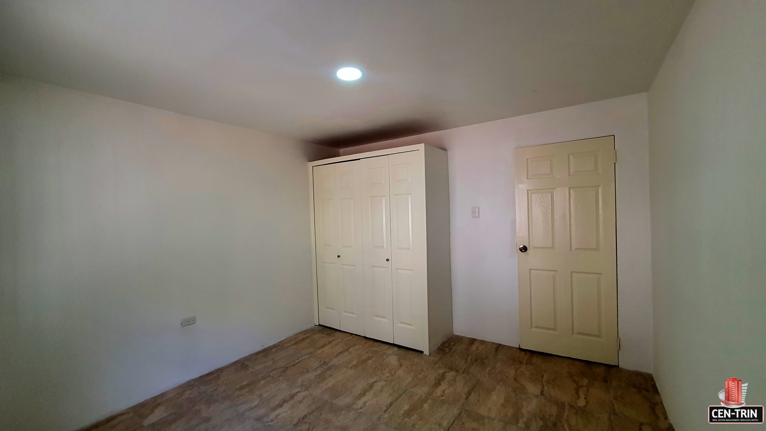 Bedroom with closet, window with blinds.