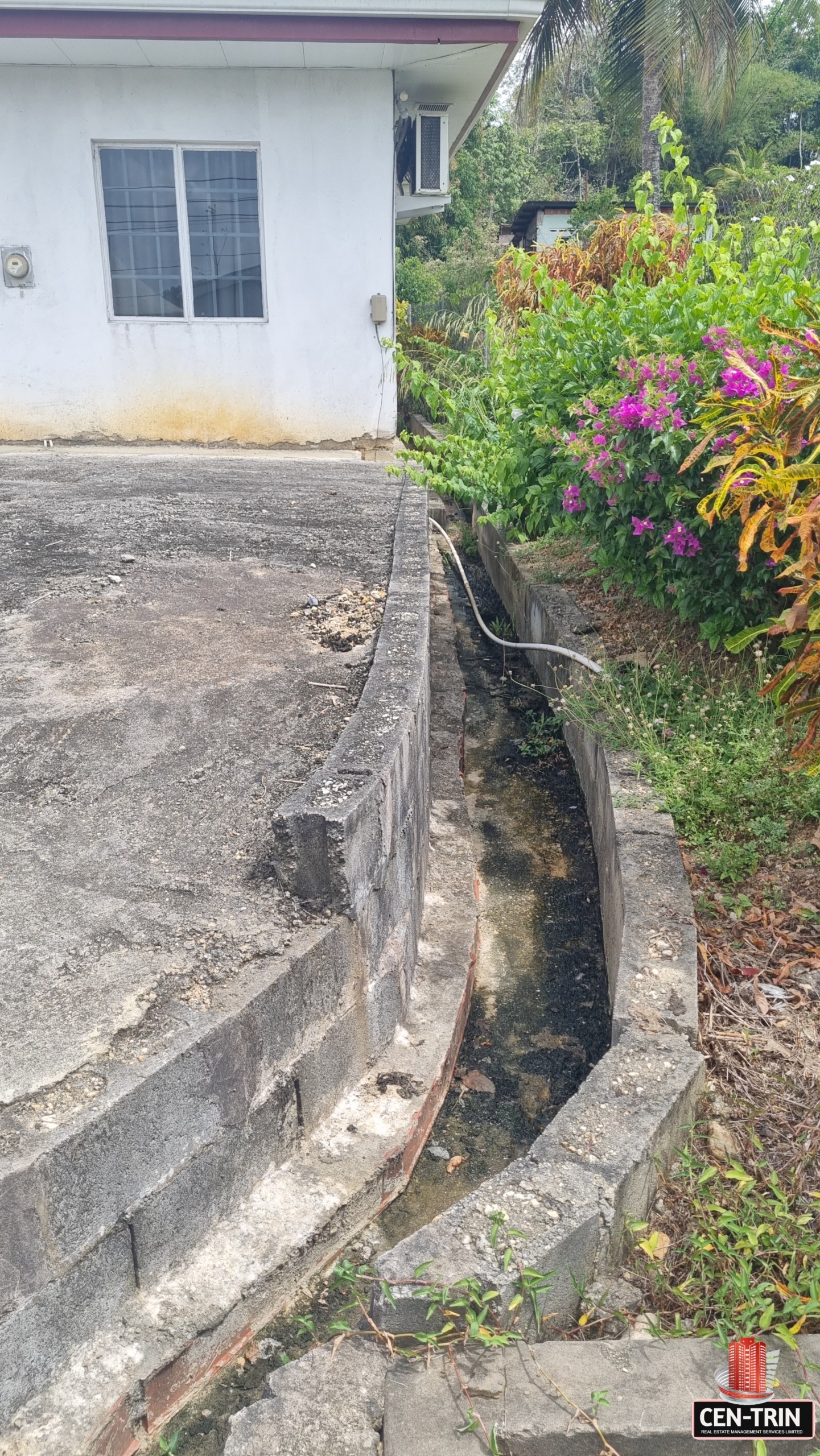 Las Lomas #1 2 Bedroom House For Sale - Front Drain Leading To main Road