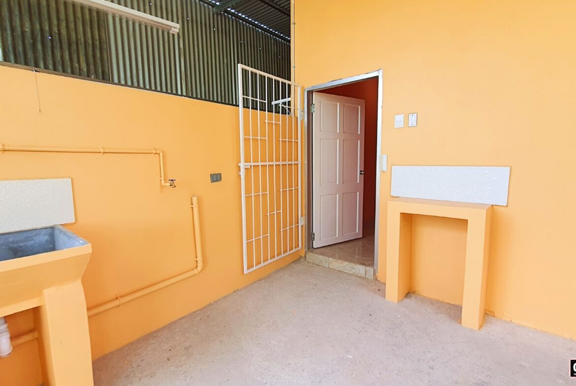 A sink on the outdoor area of the apartment for laundry
