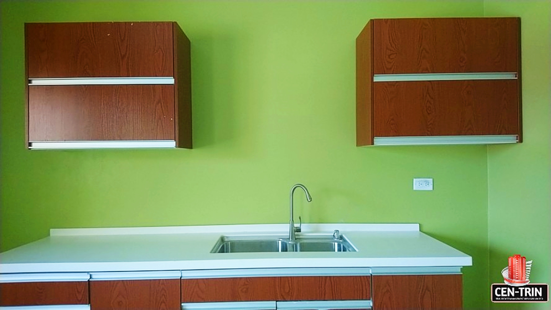Spacious & Secure Apartment for Rent in Cunupia - 2 Bedroom in a secure, gated community on Chin Chin Road, Cunupia | A bright kitchen with green walls and white countertops in a two-bedroom apartment