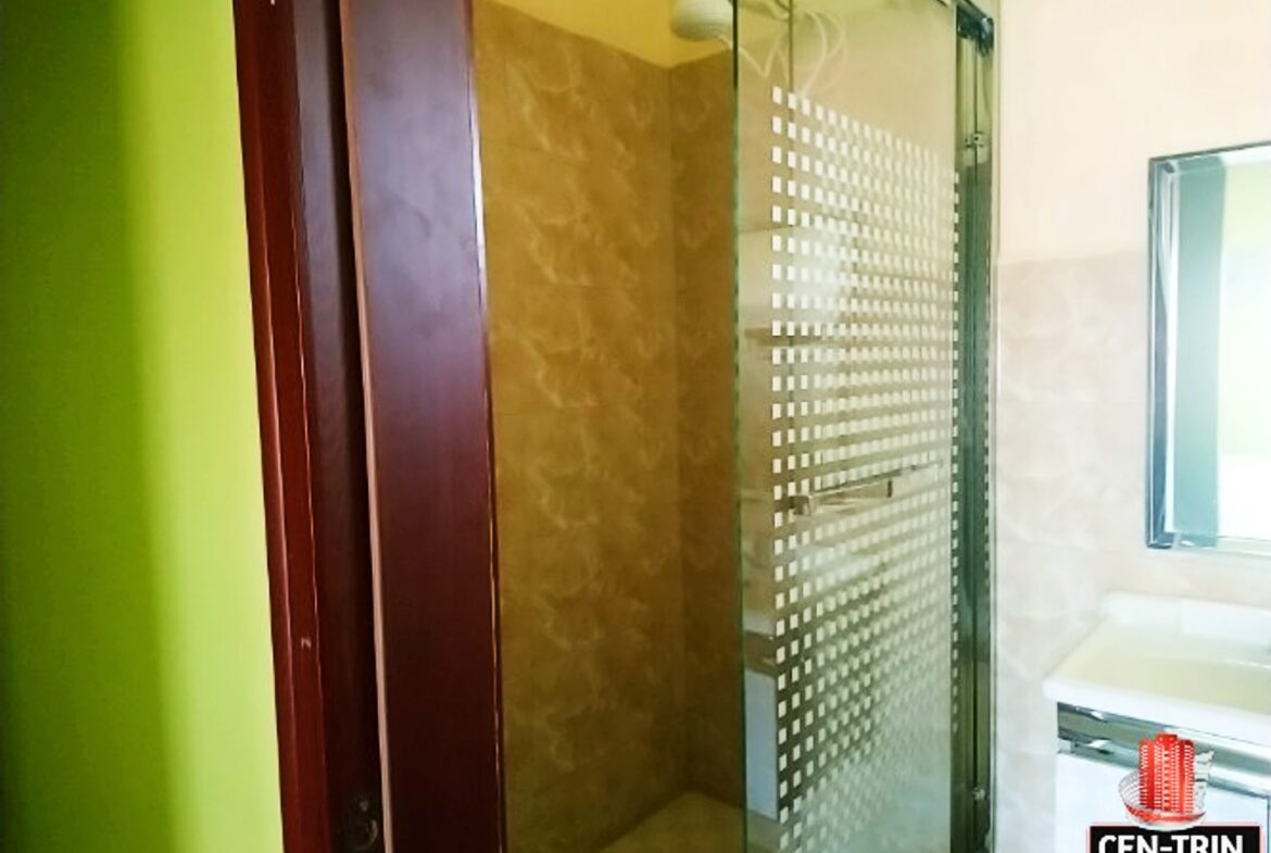 Affordable 2 Bedroom Apartments | A bathroom with a shower and sink in a two-bedroom apartment