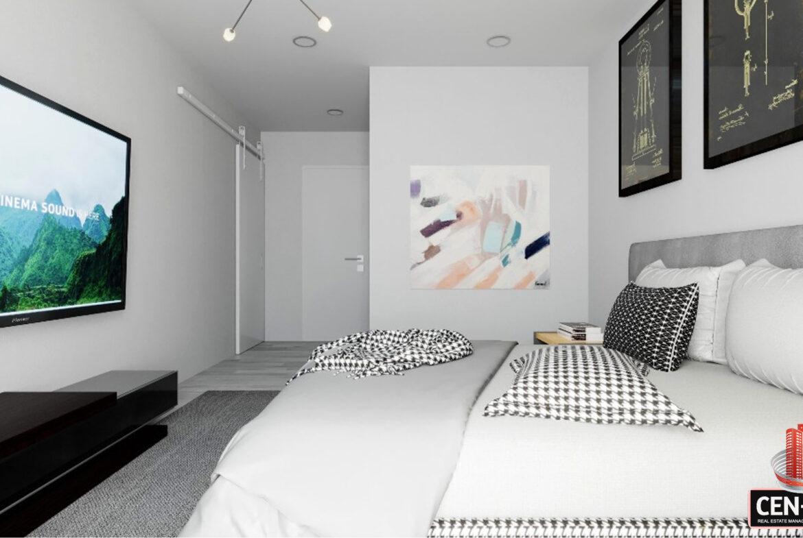 St. Geroges Units bedroom with television on wall