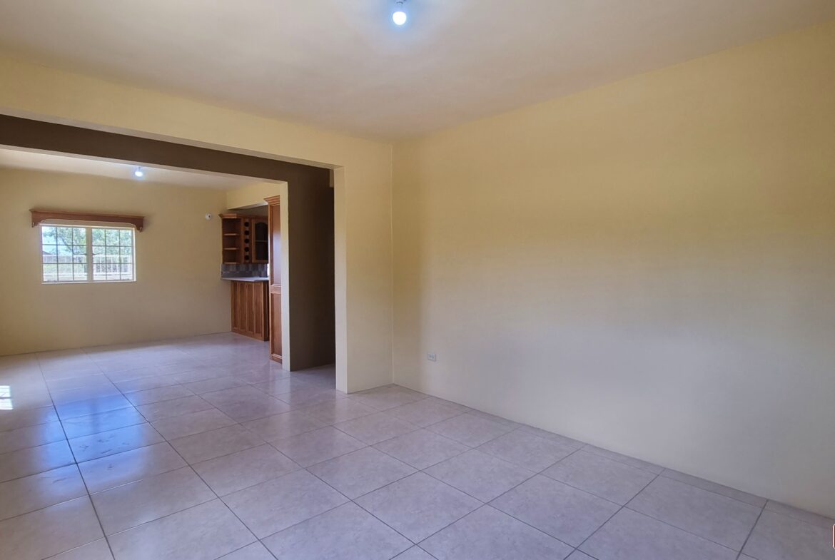 Takaaful Gardens Unfurnished open floor living and dining room area