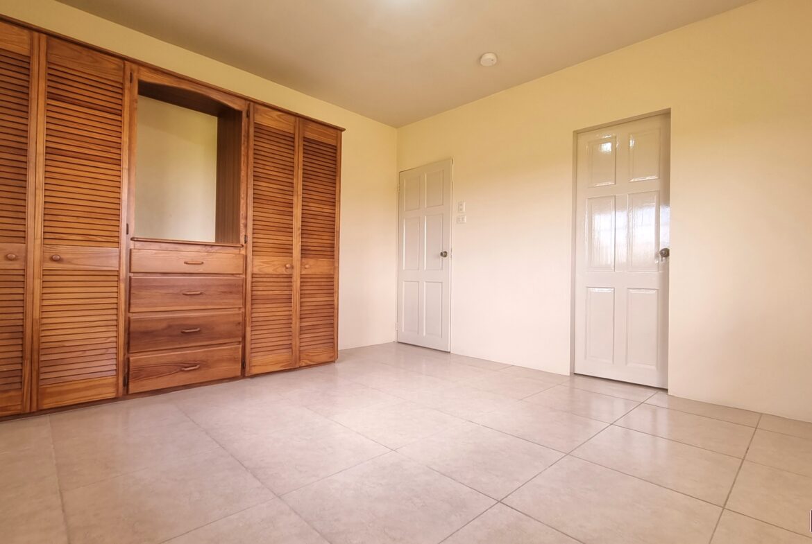 Bedroom in townhouse for sale with closet.