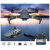 Black RX Drone X Pro with a camera mounted on a gimbal underneath, flying over a body of water.