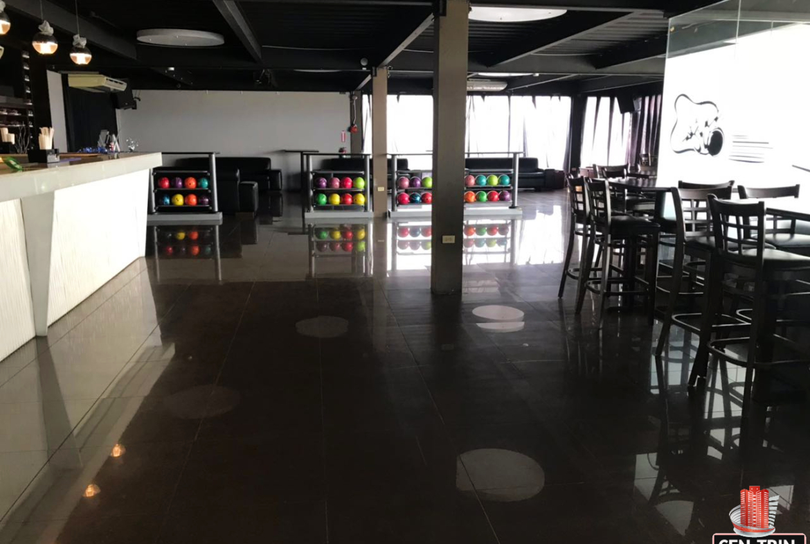 Modern bar and seating tables in a commercial investment building for sale in Calcutta Freeport, Trinidad.