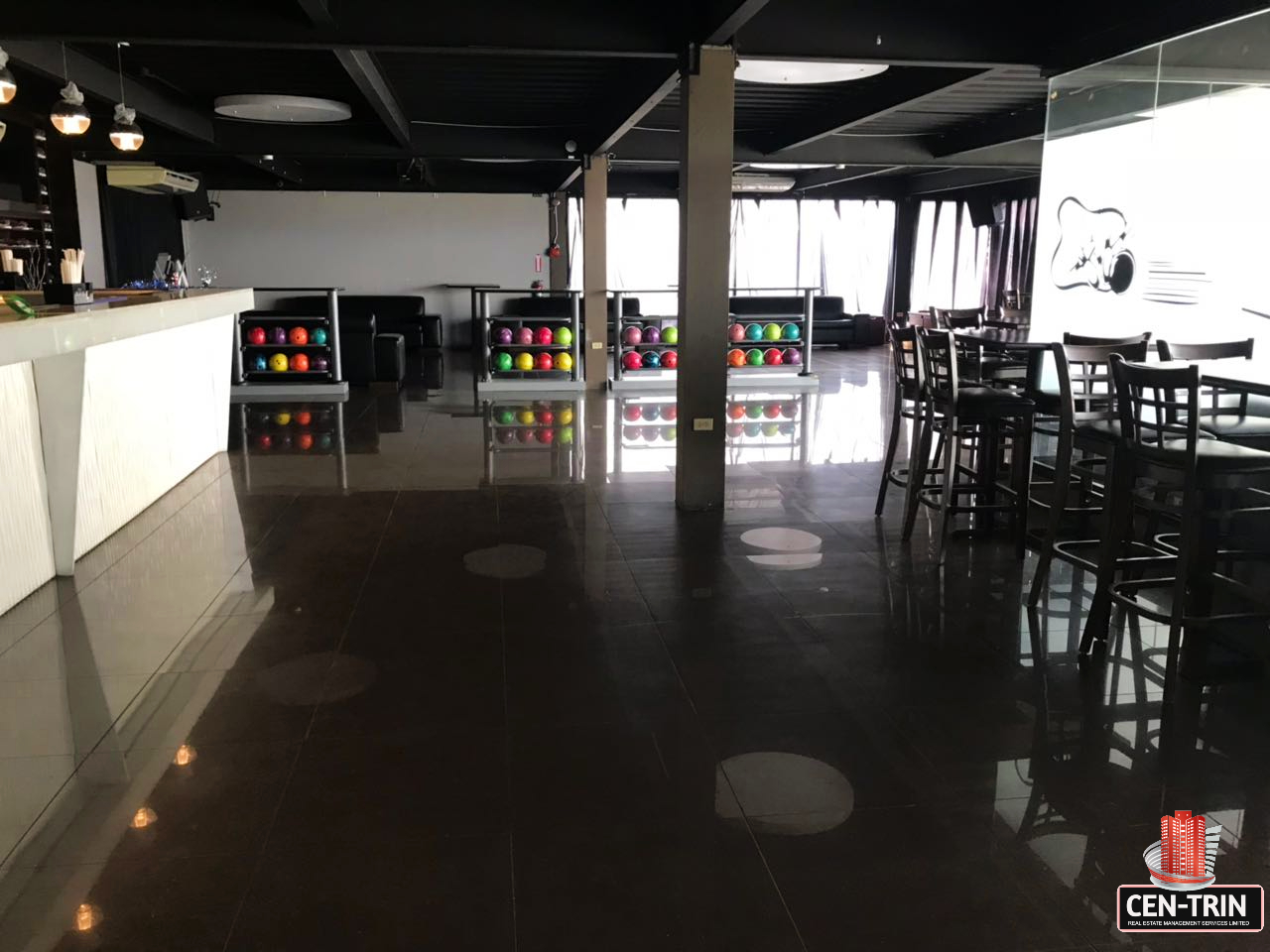 Modern bar and seating tables in a commercial investment building for sale in Calcutta Freeport, Trinidad.