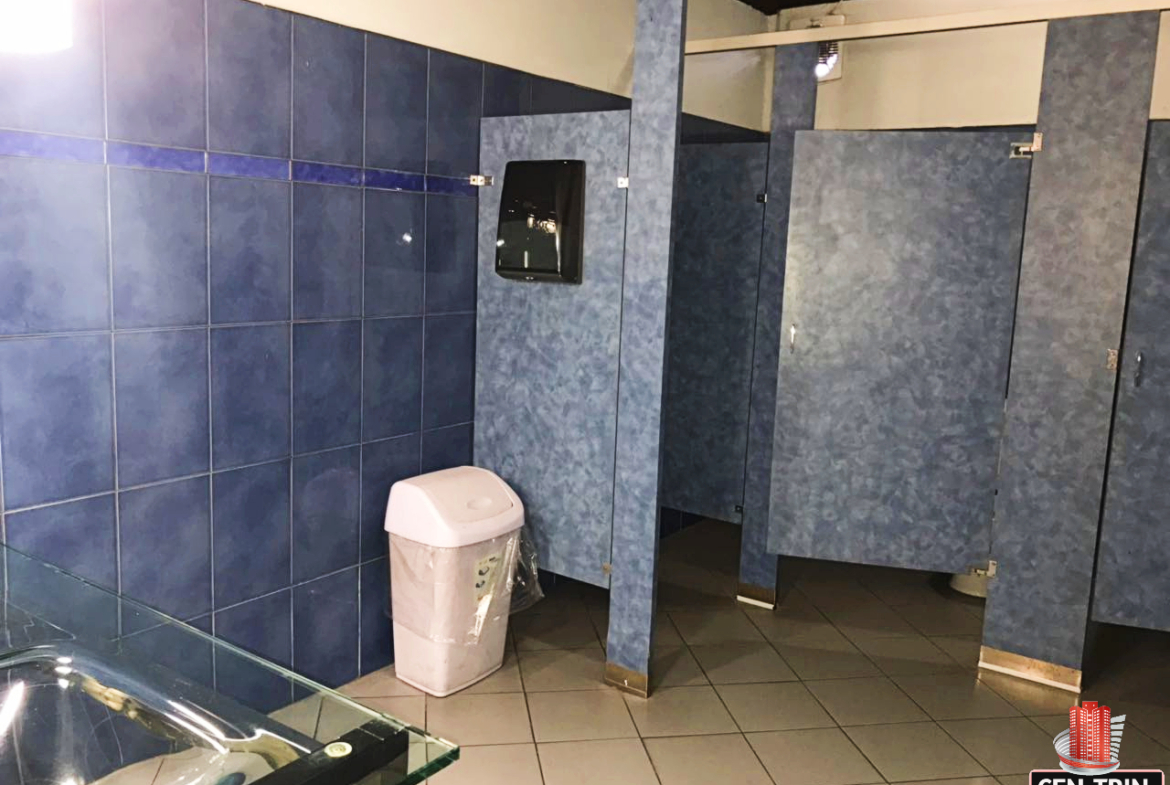 Modern and well-maintained washroom facilities within a commercial investment building in Calcutta Freeport, Trinidad.