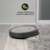A Tzumi SmartClean 2000 robot vacuum cleaner navigating a carpeted floor, demonstrating its ability to handle different floor surfaces.
