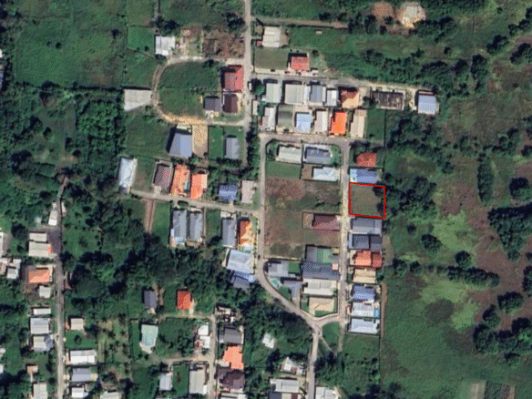 A satellite map view of the Krystal Gardens development in Freeport, Trinidad, showing Lot 10 and Lot 11 as prime approved land for sale in Trinidad, with markers for 5,000 sq ft per lot, gated development, fully approved status, and location in Freeport.