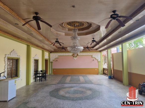 Expansive luxury home for sale in Cunupia featuring a grand entertaining area, pool, and furnished interiors.