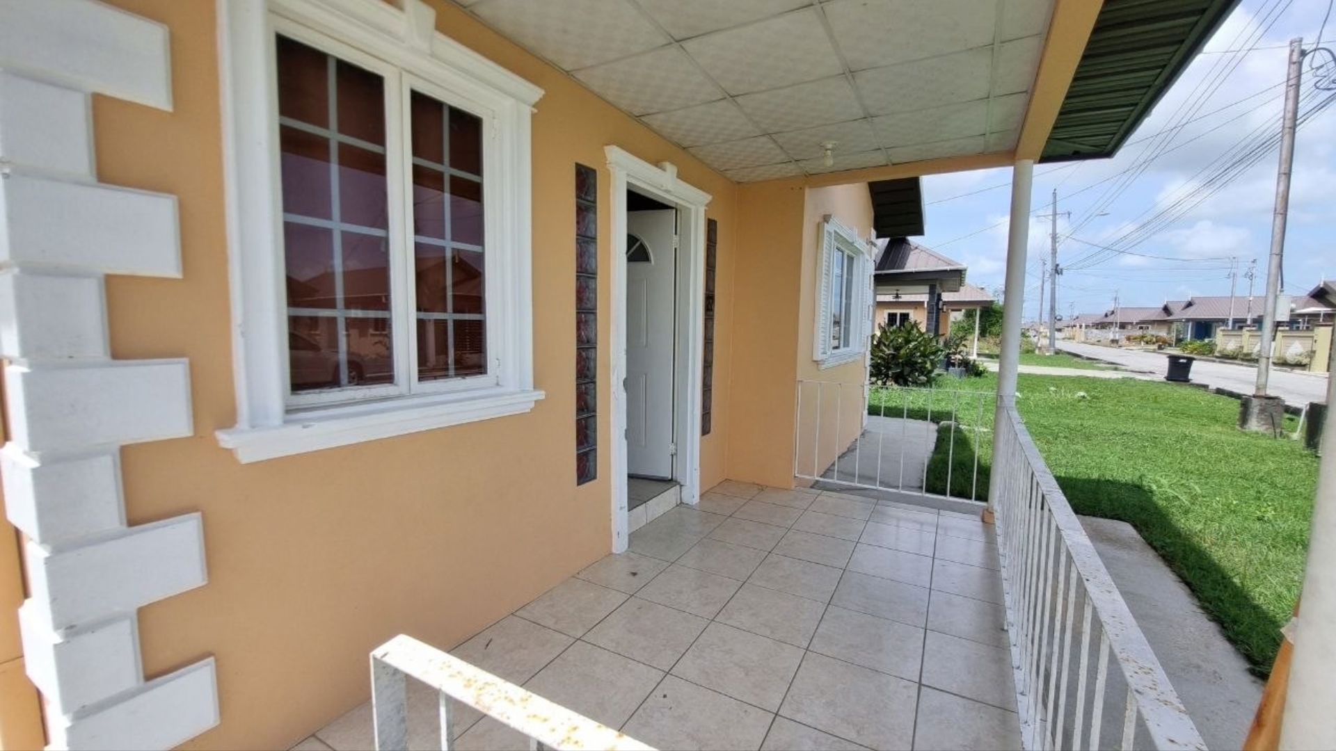 House for Rent | Eden Gardens, Freeport Tiled Porch Covered tiled front porch and main entrance door of house for rent in Eden Gardens Freeport