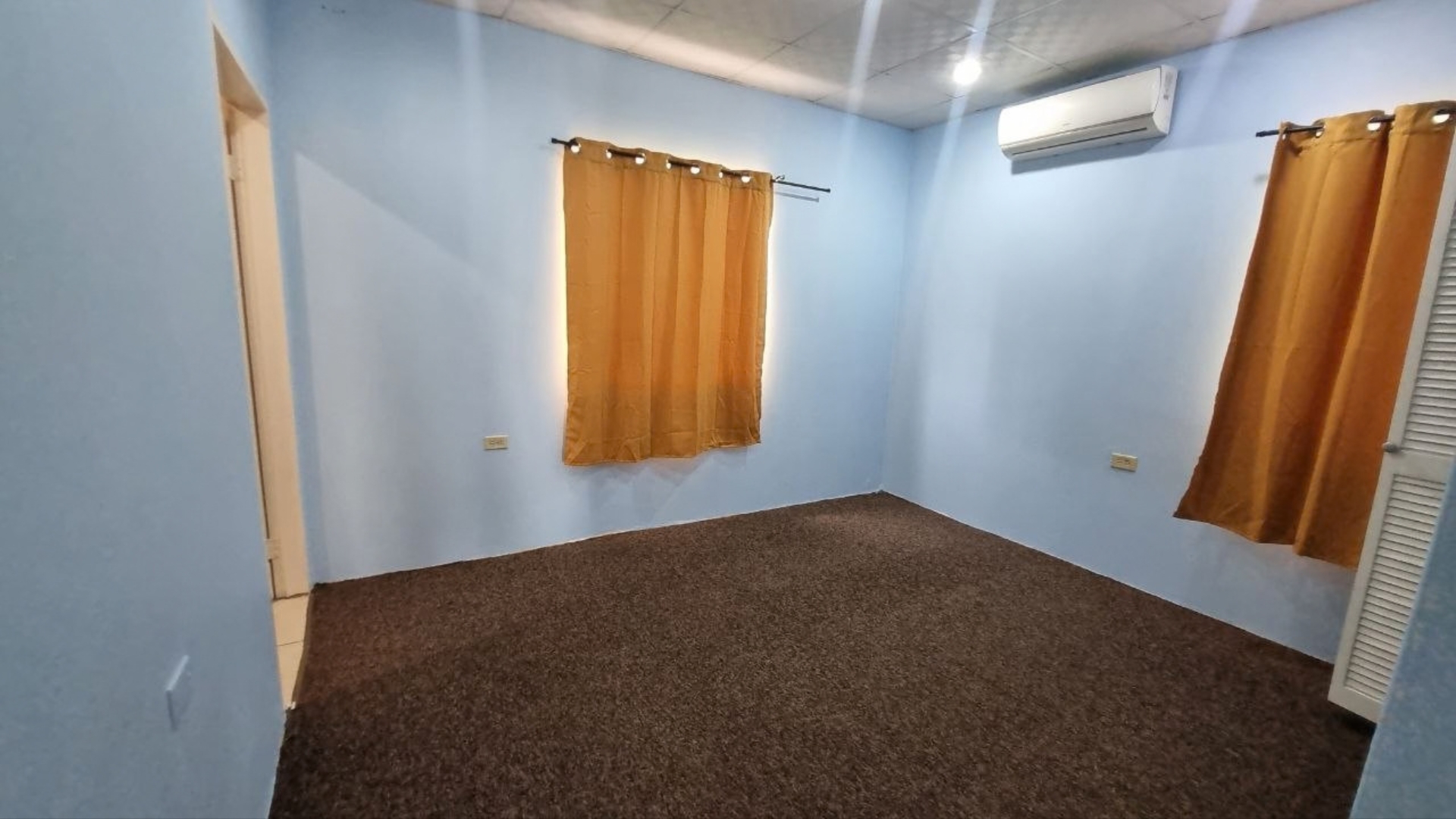 House for Rent | Eden Gardens, Freeport AC Bedroom Air conditioned bedroom with dark carpet floor in house for rent Eden Gardens Freeport