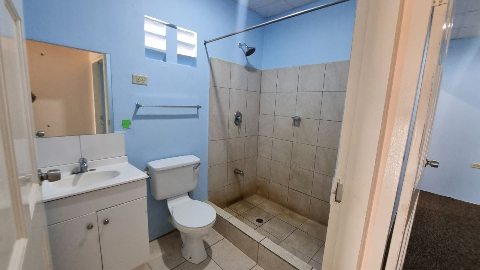 House for Rent | Eden Gardens, Freeport Full Bathroom Full bathroom with vanity sink toilet and tiled shower in house for rent Eden Gardens Freeport